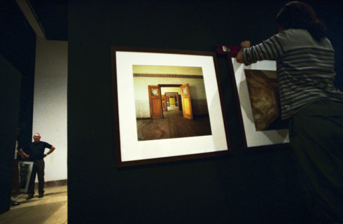 Setting up photographic exhibition at the National Museum before the launch of the 6th African