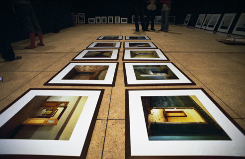 Setting up photographic exhibition at the National Museum before the launch of the 6th African