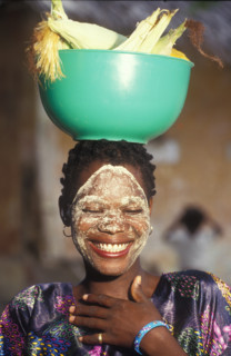 AB0027, Mozambique,1990's: Mozambique A lady carrying mealies, traditional, food, crops