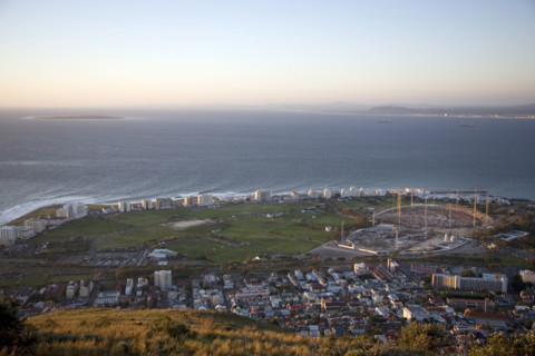 Seen from Signal Hill, construction cranes rise above the site of the new Greenpoint Stadium in