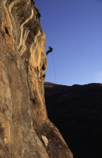abseiler silhouetted against the sky