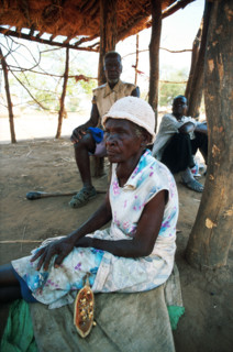 Woman eating Baobab fruits