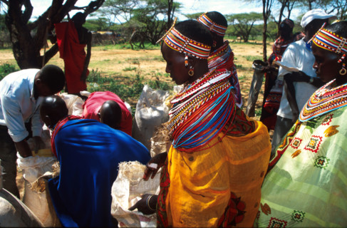 Young Samburu women stand in line waiting to get food from aid workers with EdFri International at Lkisin some kilometres down a dirt track outside the town of Wamba