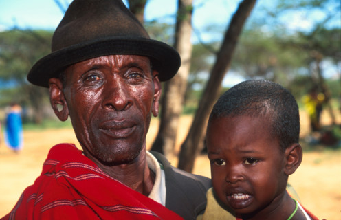 Koliaas Longonyek with a child who may be his grandson or even son. Longonyek is the elder in charge of peace among the warriors in his area, Lkisin