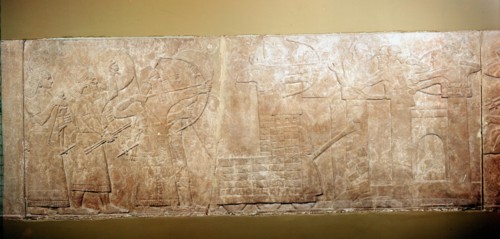 Ashurbanipal II, King of Assyria 833-859 BC, leading assault on city with battering rams and siege