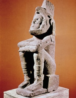 Aztec sculpture of seated male figure