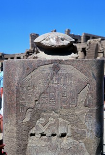 Scarab surmounting relief of a pharoah receiving tribute