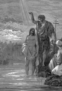 John the Baptist, wearing an animal skin, shown baptising Jesus