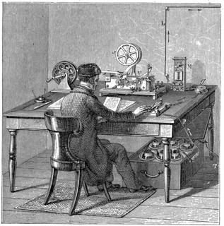 Operator sending a message on a Morse electric printing telegraph