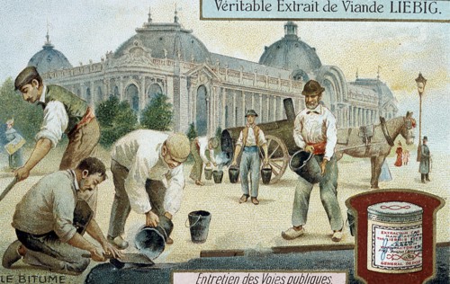 Laying bitumen road surface in a Paris street