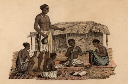 Hindu schoolmaster overseeing four boy pupils