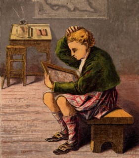 Scottish schoolboy dressed in a kilt and woollen threequarter hose
