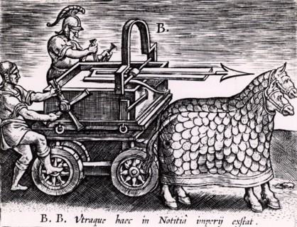mounted on a carriage drawn by two mailed horses