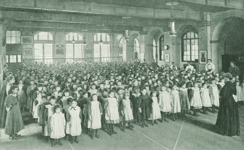 Assembly in a girls' school in the East End of London, 1910