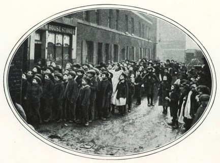 School children in the East End of London queueing for free meals, c1910