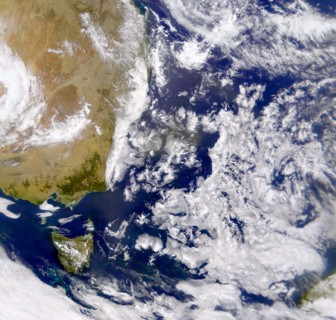 Satellite photograph of the Tasman Sea partially covered by cloud