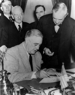 President Franklin Roosevelt signing the United states declaration of war