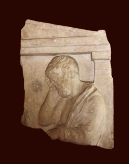 Grave relief depicting a man in sorrow