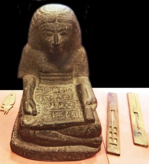Scribe sitting cross-legged