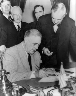 President Roosevelt signing the declaration of war