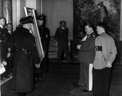 Hermann Göring shows a confiscated painting to Adolf Hitler