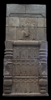 cast of Xerxes  sitting on a throne holding a sceptre and lotus flower