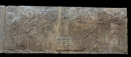 King Ashurnasirpal leads an attack on an enemy town