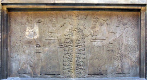 King Ashurnasirpal shown in a dual depiction at the Sacred Tree
