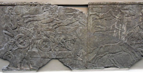 King Ashurnasirpal leads an attack on an enemy town