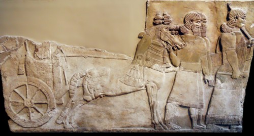 Chariot with wheel depicted in a stomne relief from Nimrud