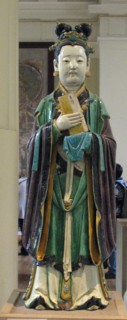 Stoneware figure from a judgement group with aubergine