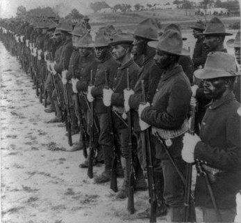 Some of our brave collared boys who helped to free Cuba"  Formation of Black soldiers, after Spanish-American War