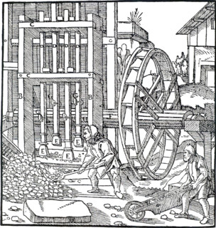 Overshot water wheel turning the cam-shaft of a stamping mill