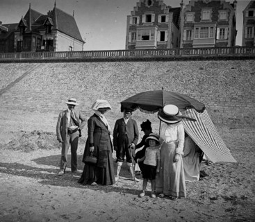 A French family group gathers on a beach in France