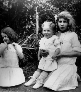 young French children play in a garden