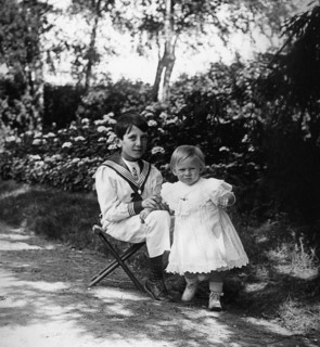 young French children play in a garden