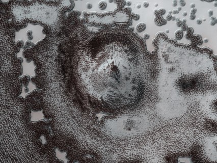 4 kilometer diameter feature near the edge of the South polar residual cap