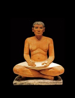 Scribe sitting cross-legged with a papyrus in his lap 2350 B