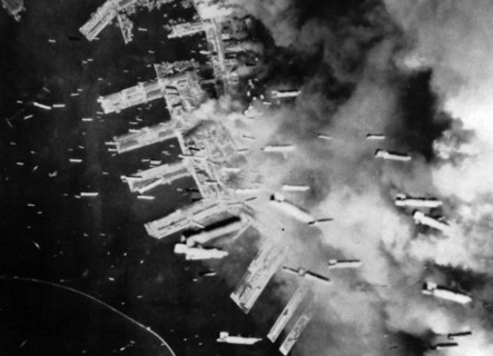 The Japanese port of Kobe is bombed by US aircraft