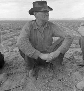 Harlingen (vicinity), Tex. Migrant worker sitting in front of fire. He lived with two other men workers By Russell Lee, 1903-1986, photographer 19390101.