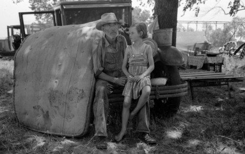 Veteran migrant agricultural worker with his daughter camped on Arkansas River, Wagon County, Oklahoma By Russell Lee, 1903-1986, photographer 19390101.