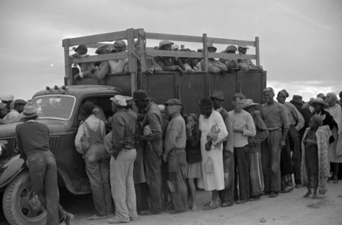 Vegetable workers, migrants, waiting after work to be paid. Near Homestead, Florida 19390101