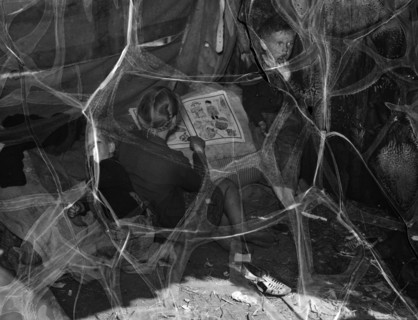 Children of migrant packing house workers, living in a lean-to made of pieces of rusty tin 19390101
