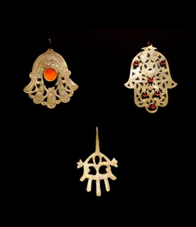 Gold palm shaped amulet, known as, the Hamsa throughout the Middle East and Africa
