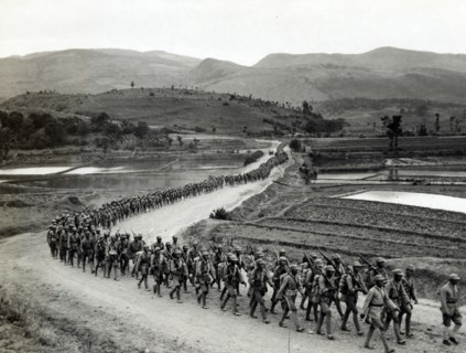 photographic print of Chinese soldiers marching on road in Burma Road heading toward the Salween front