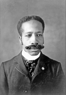 African American man, head-and-shoulders portrait, facing front.