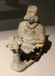 ceramic figure of an older female, depicted in a Mayan statuette