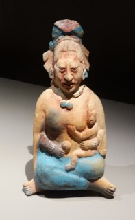 Mayan ceramic figurine of a noblewoman with a small child,