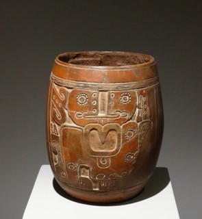 Mayan ceramic vase, with an engraved figure of a god with a large nose