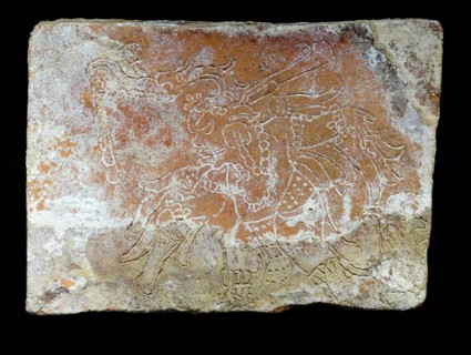Ceramic brick depicting a dancer from the Mayan ruins at Comalcalco